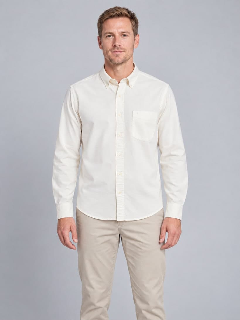 Ivory oxford shirt on an AI model in his 30s, framed to the knee